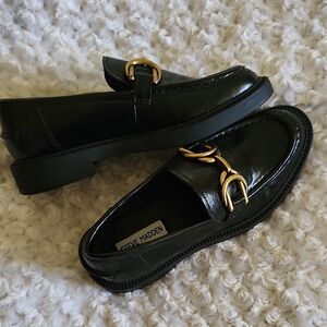 Steve Madden Glossy Black Loafers with Gold Buckles